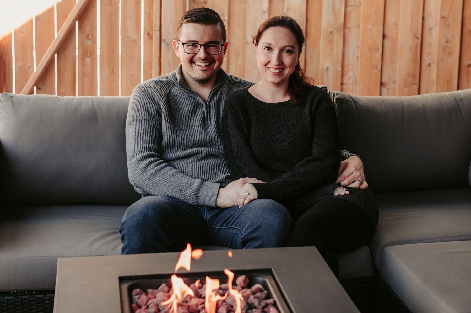 couple posed at fire