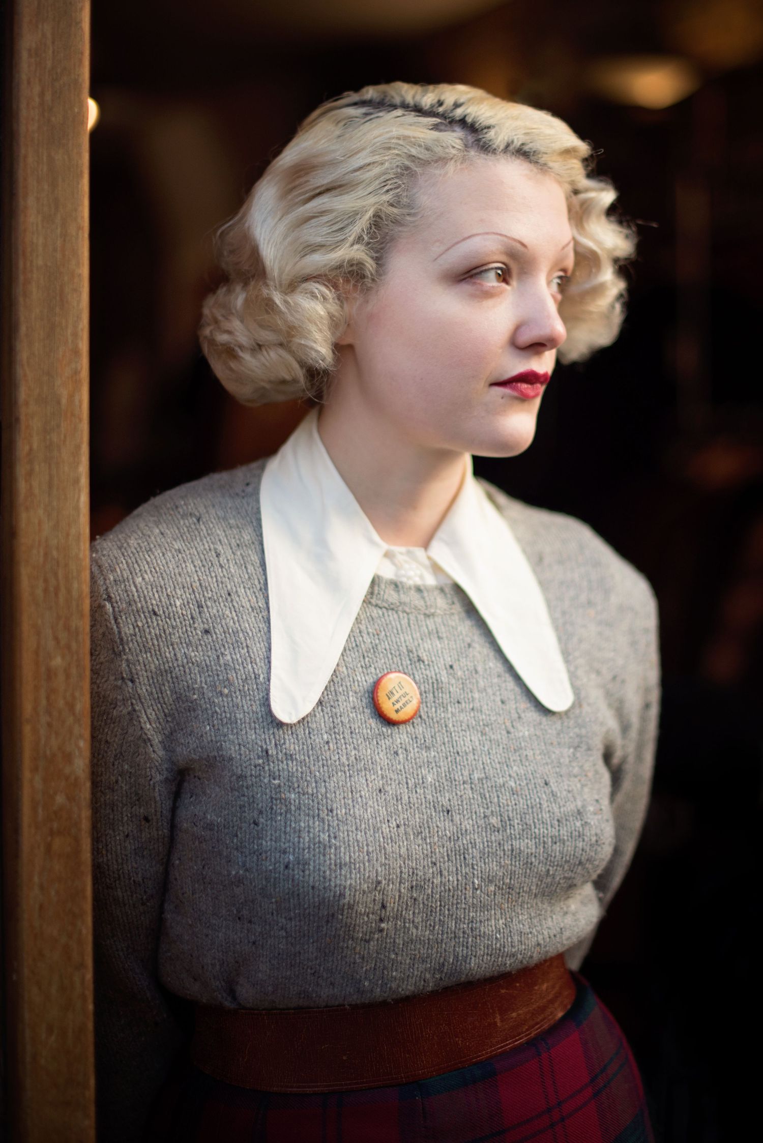 Beautiful portrait of a woman in vintage clothing, hair and makeup at Shoreditch's Hunky Dory shop