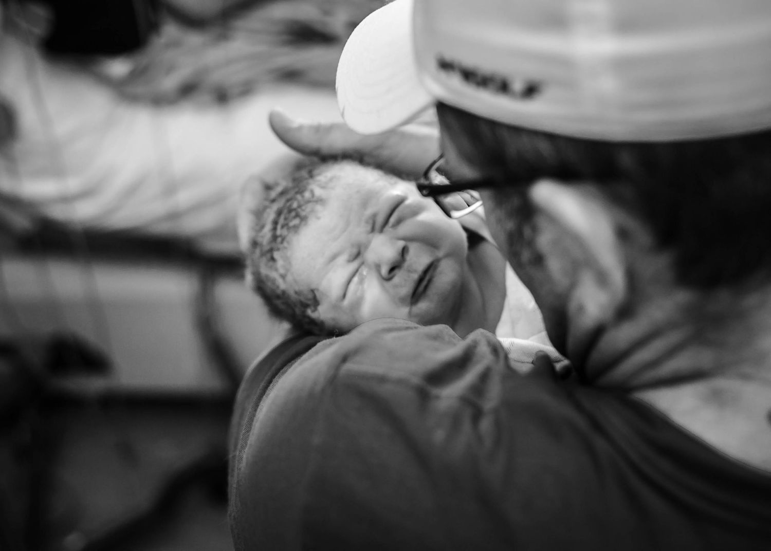 Newborn baby held by his dad in the Labor and Delivery unit at Unity Pointe health of Sioux City, IA.
