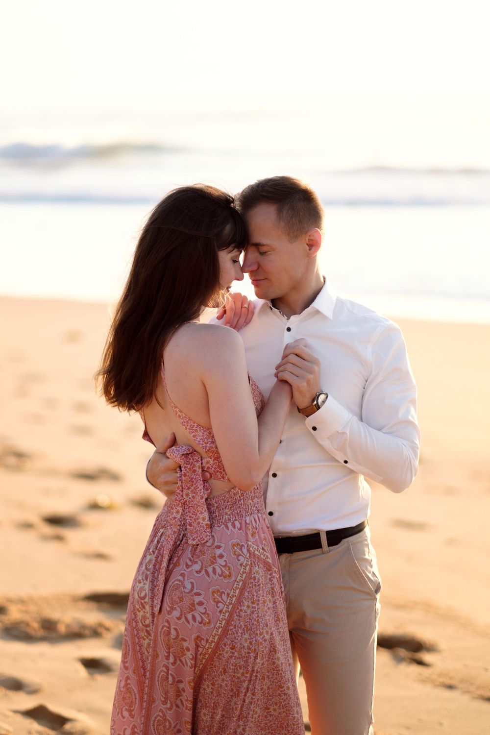 couple dancing during an engagement photo session in Sydney - Turimetta beach