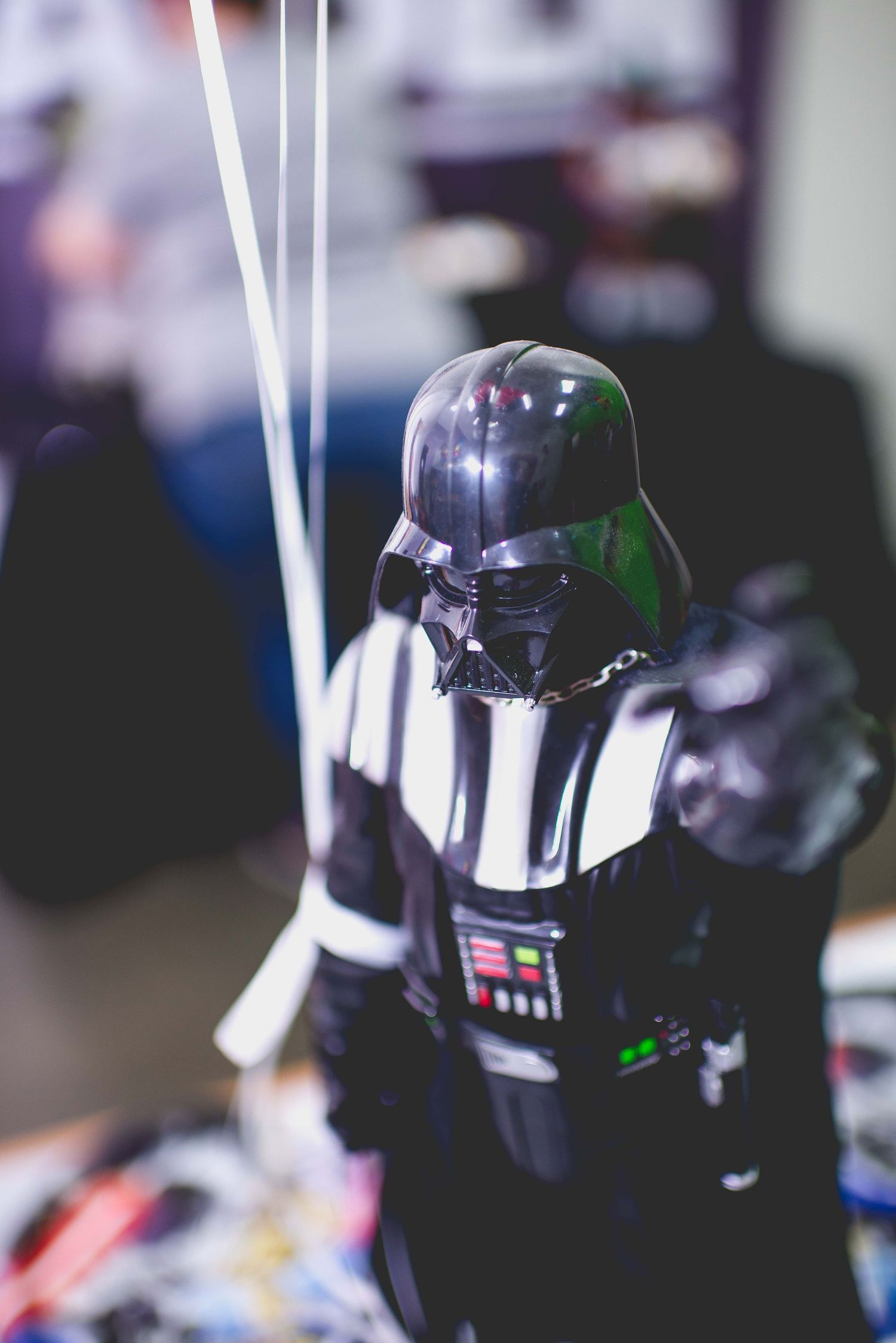 darth vader holding birthday balloons