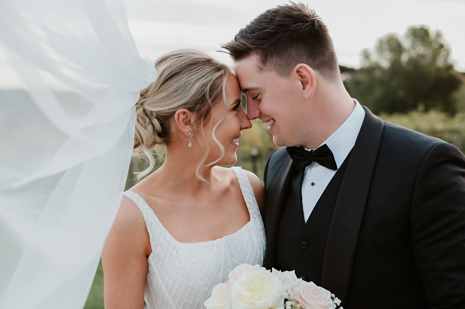 romantic image of bride and groom by tasmanian elopement and wedding photographer joss jensen