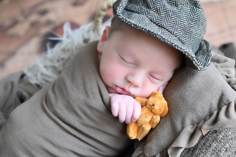 newborn baby elegantly placed for newborn girl/boy photo session
