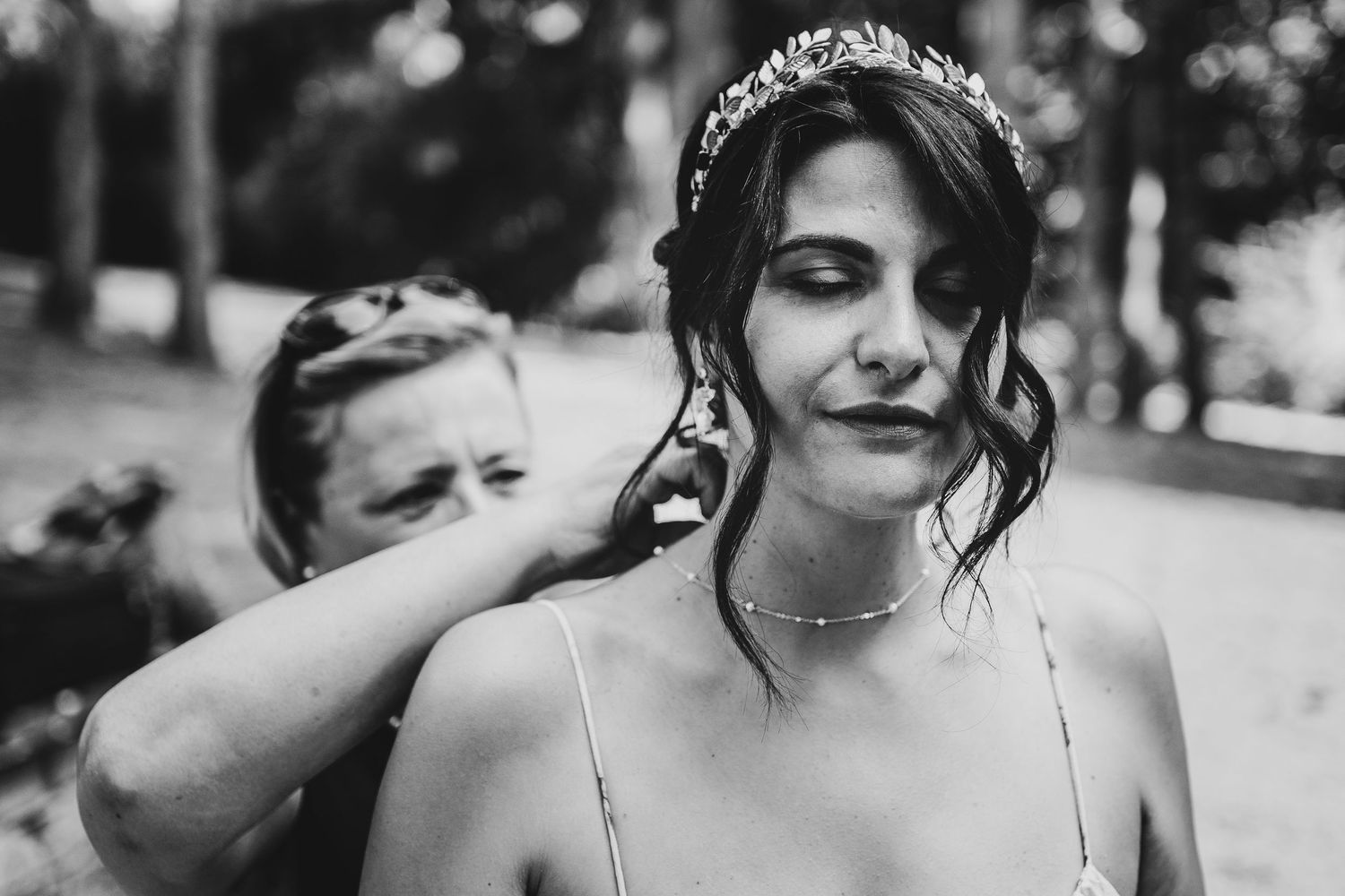 A black and white portrait shows someone wearing a delicate tiara.