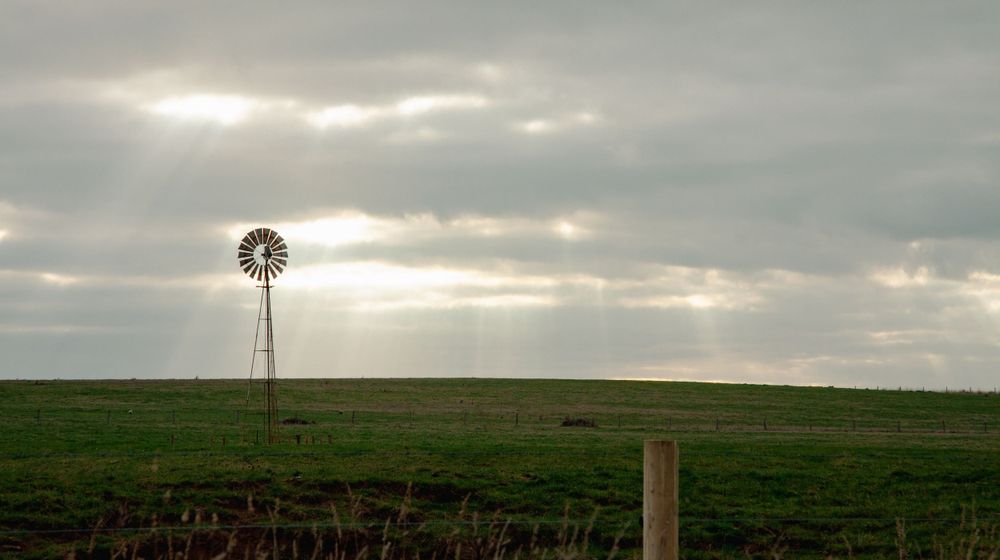 windmill landscape stormy skies