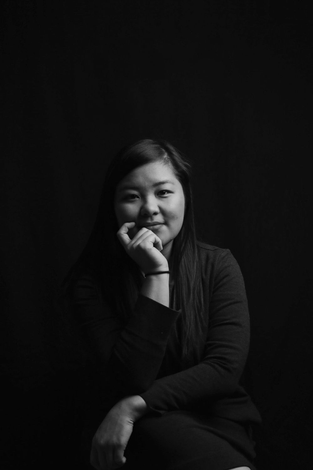 Black and white portrait series against dark background in dramatic lighting.