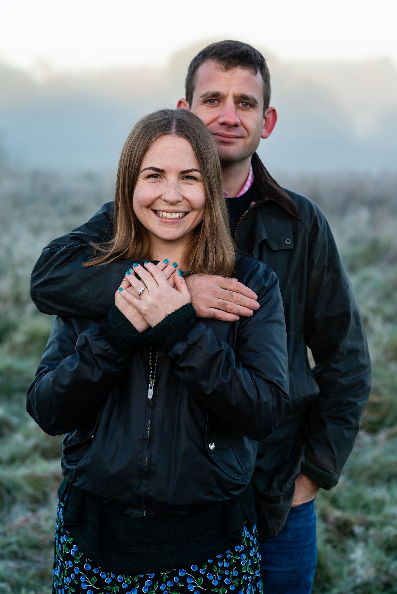 Engaged couple embracing on Stockbridge Common, National Trust, Engagement Photoshoot, Hampshire,