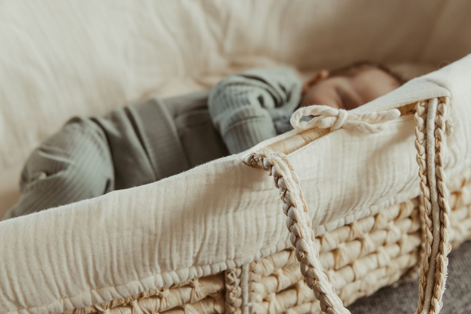 Newborn sleeping in basket