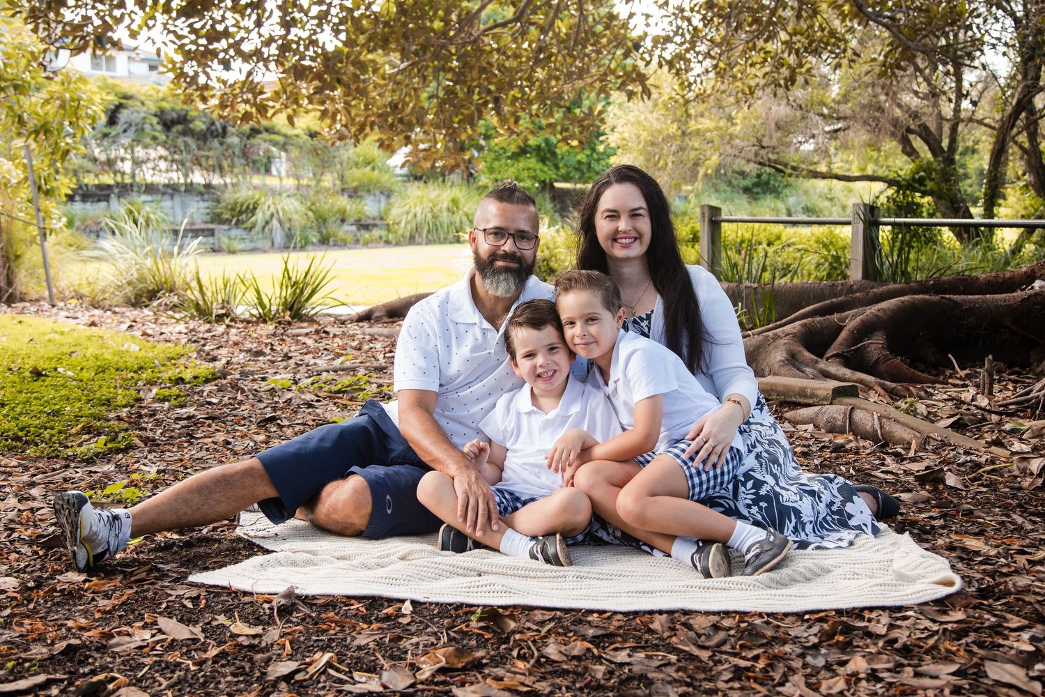 family outdoor portrait under big tree lake eden