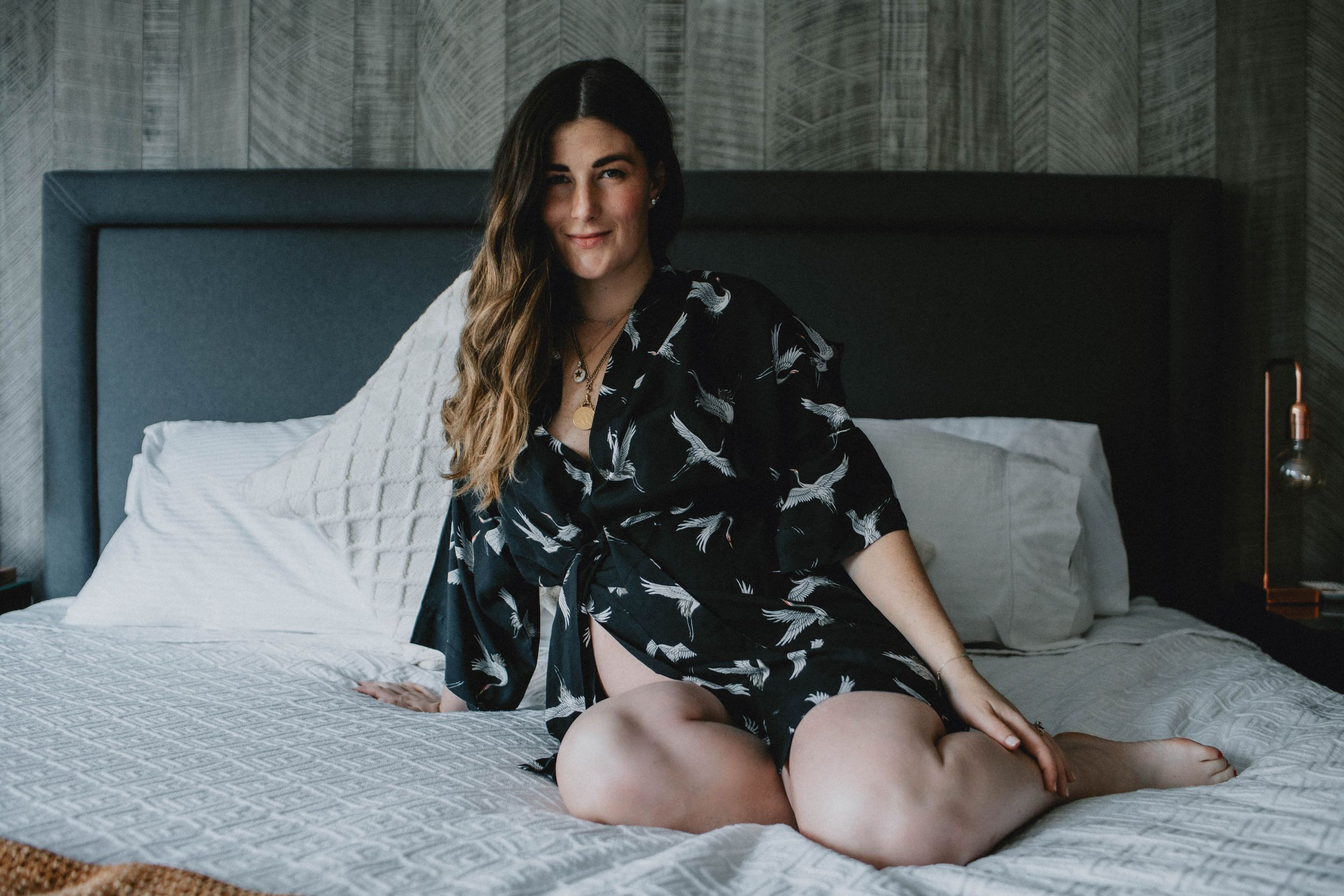 Solo indoor maternity session with a mother, emphasizing natural light and intimate pregnancy moments.