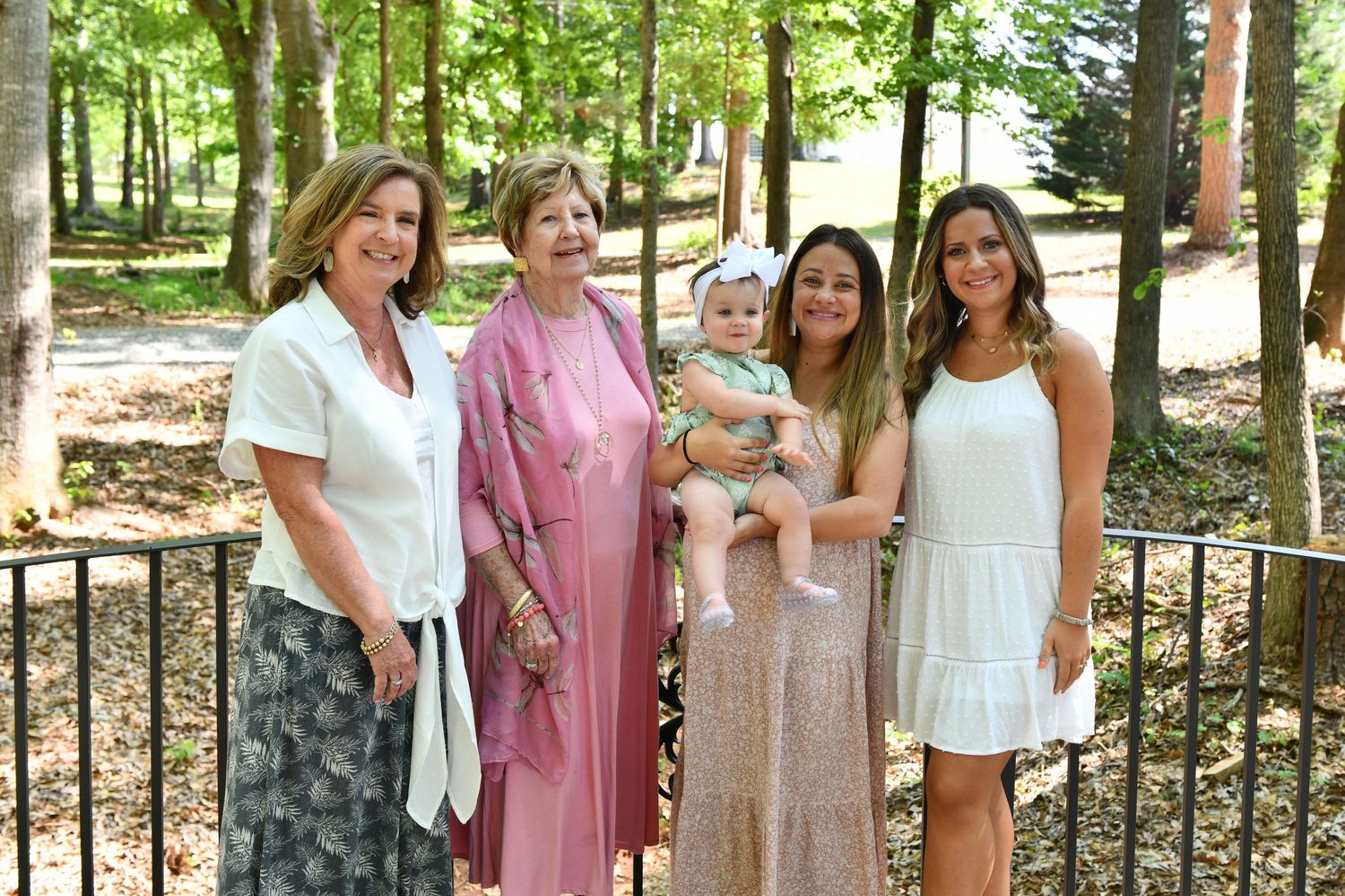 Family portraits on bridge in woods