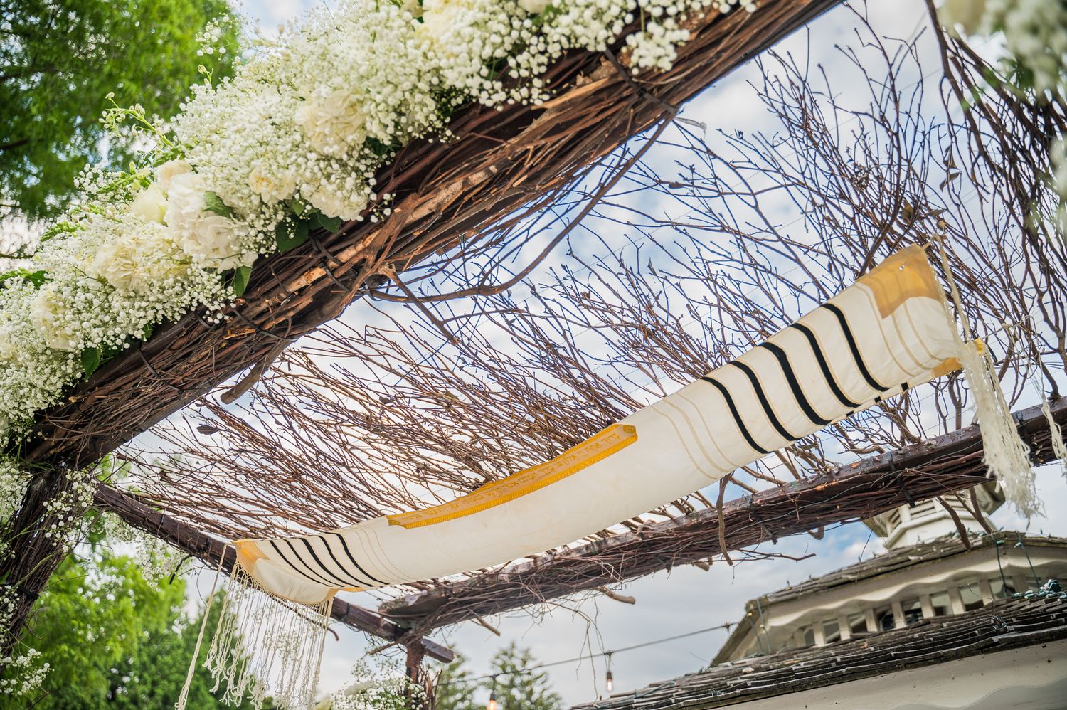 Chuppah adorned with a beautiful Tallit. Jewish ceremony