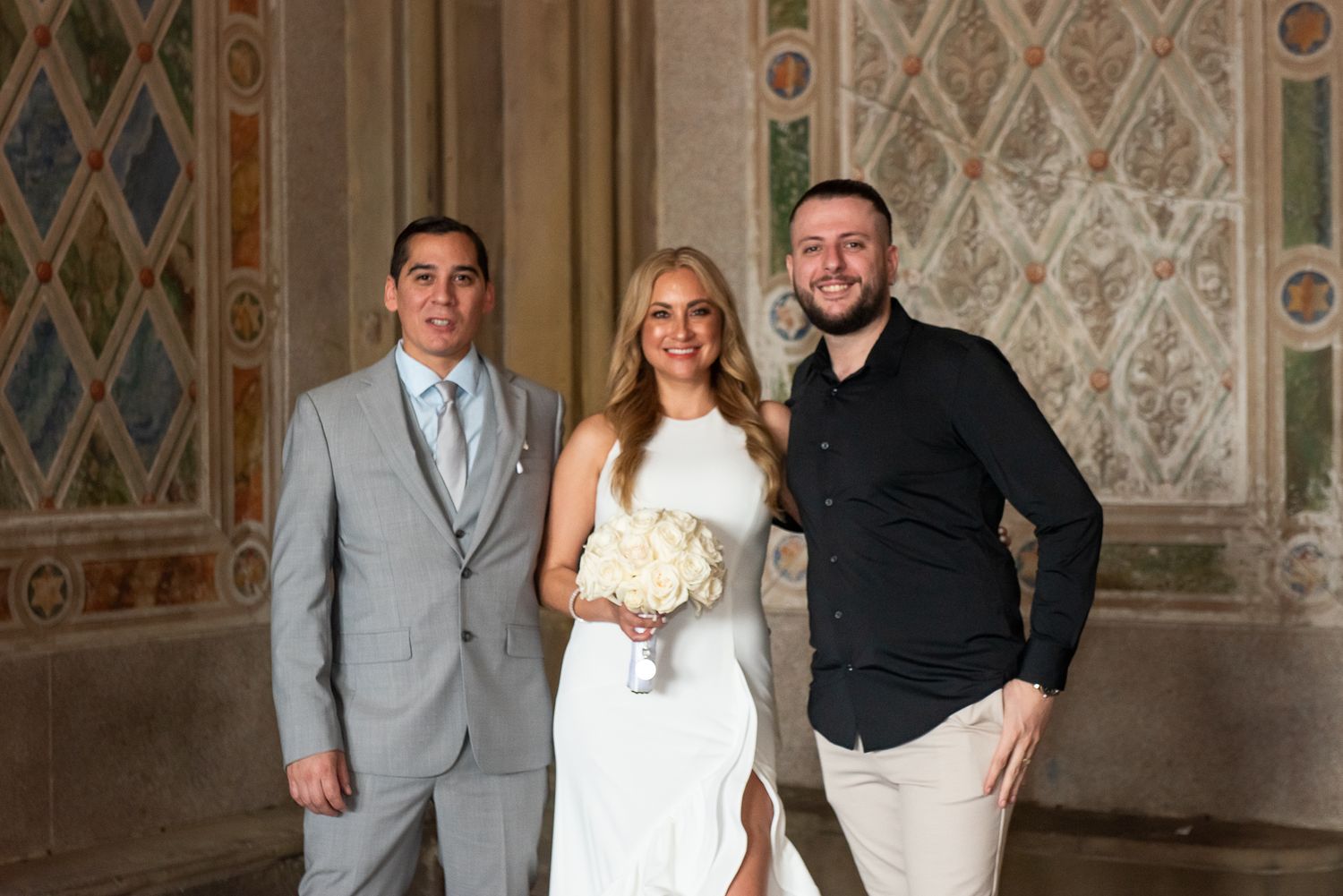 Wedding party photos in formal attire against ornate architectural backdrop.