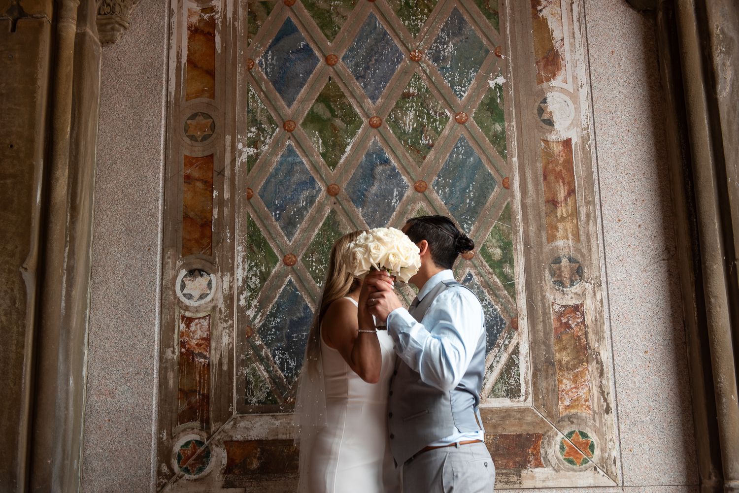 Romantic moments photographed against vintage architectural details.