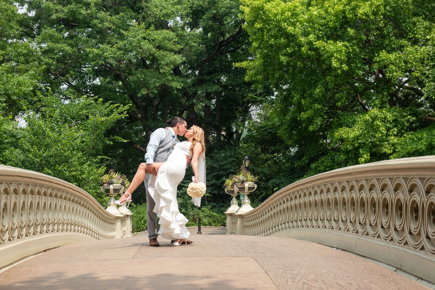 Romantic wedding photos along the ornate stone balustrade of Bethesda Terrace.