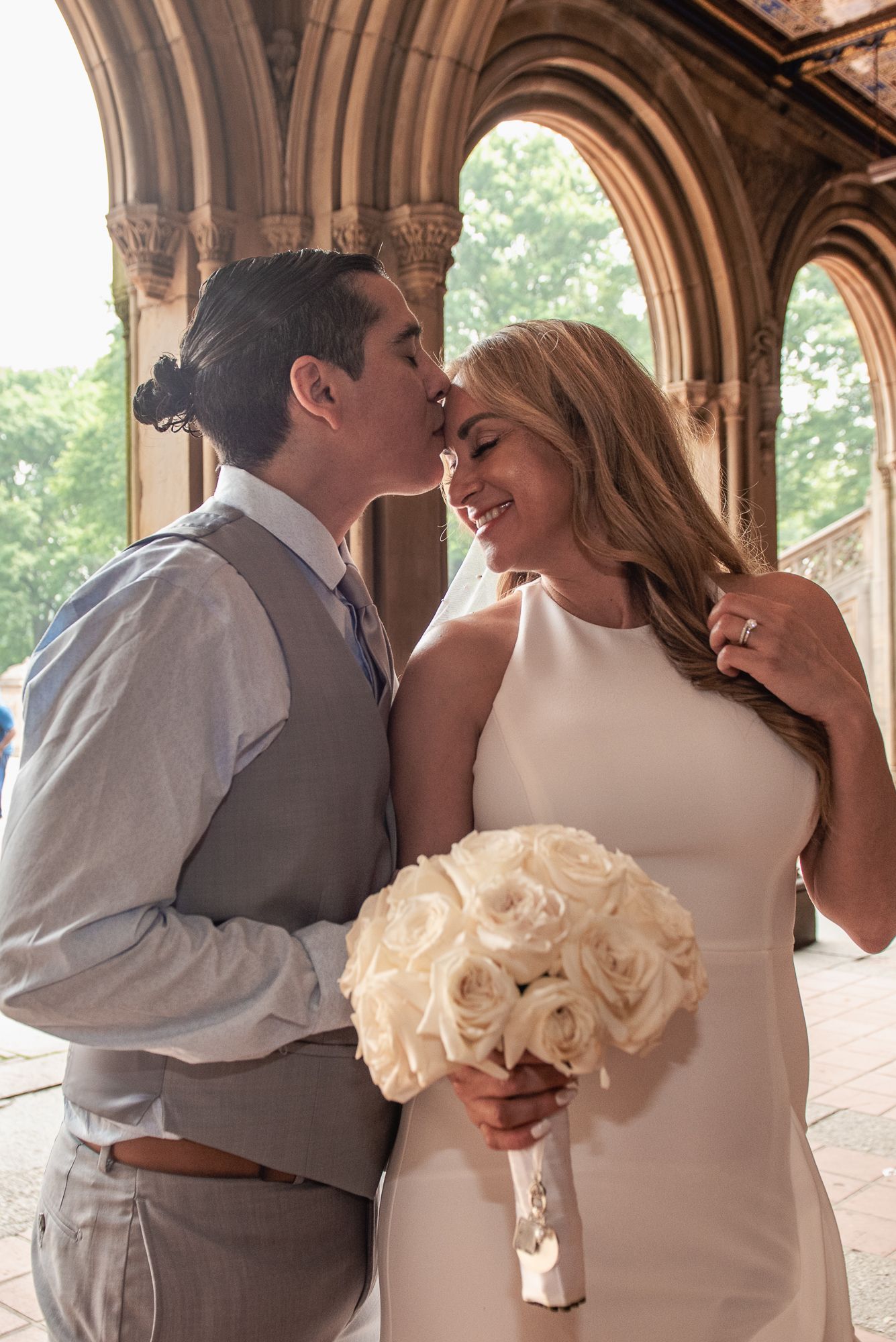 Romantic wedding photo sequence under historic stone archways.