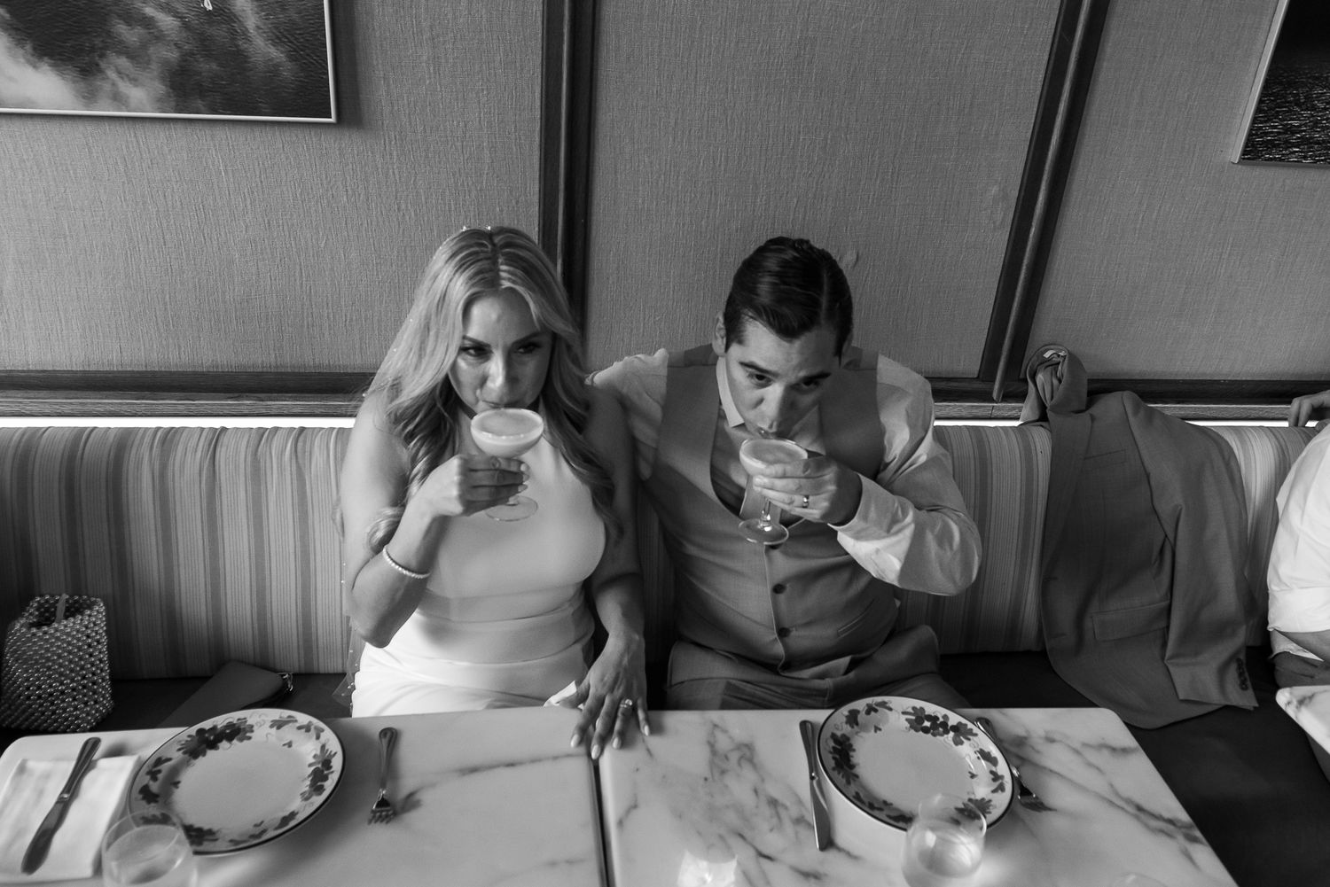 Wedding preparation moments captured in a series of candid black and white photographs.