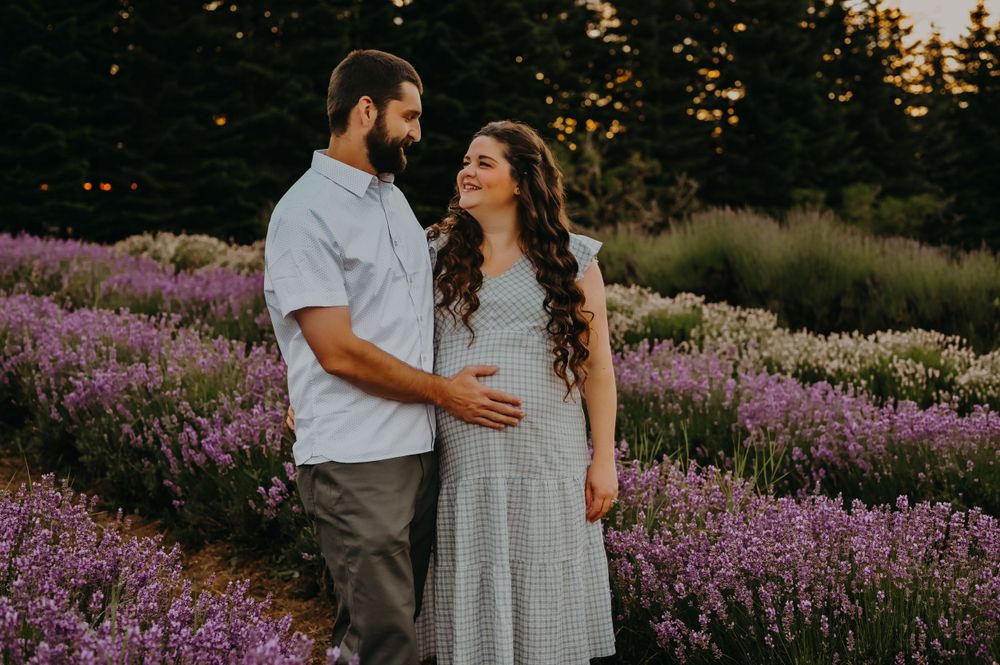 Couple embrace in a field of flowers