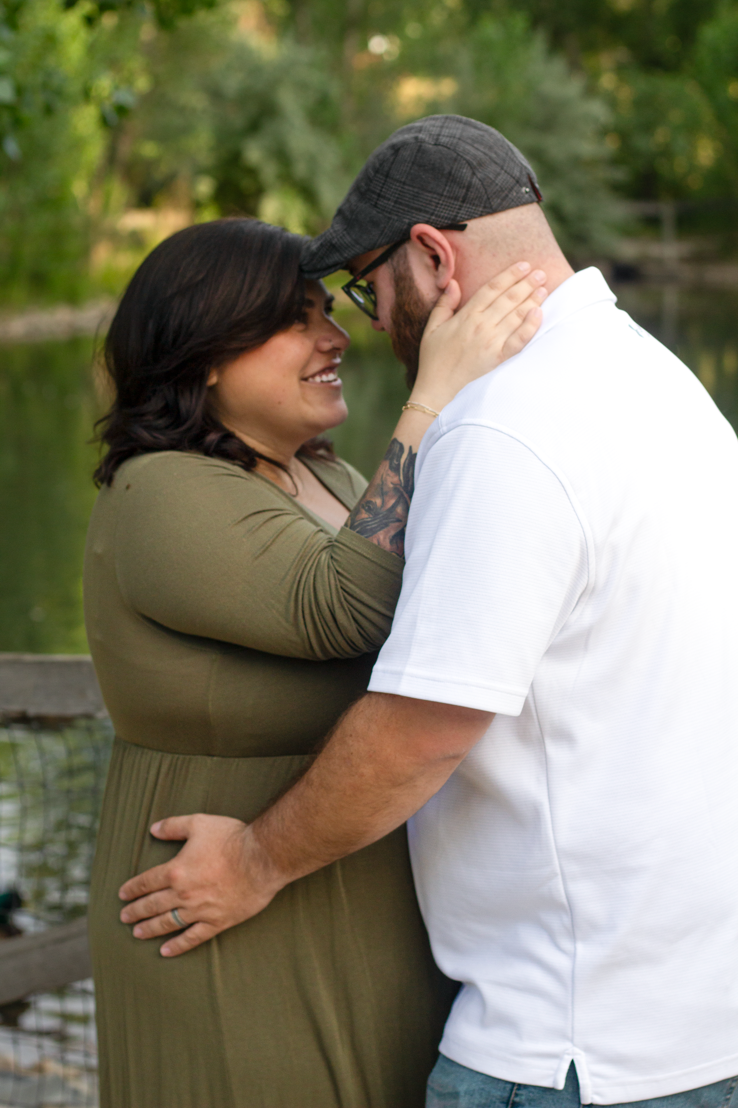 Maternity image taken at Wheeler Farm, in Murray, Utah. Mom and Dad by water.