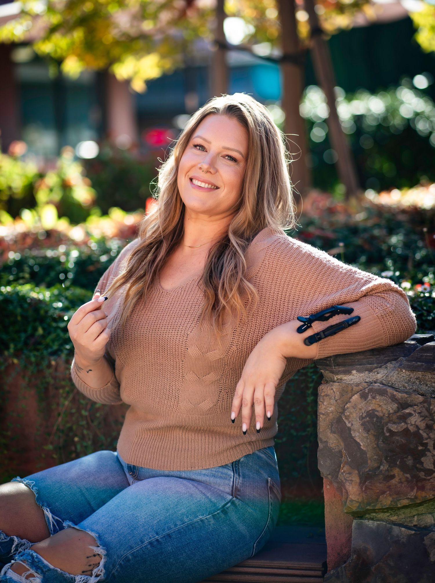 hair and makeup artist with a sweater and jeans