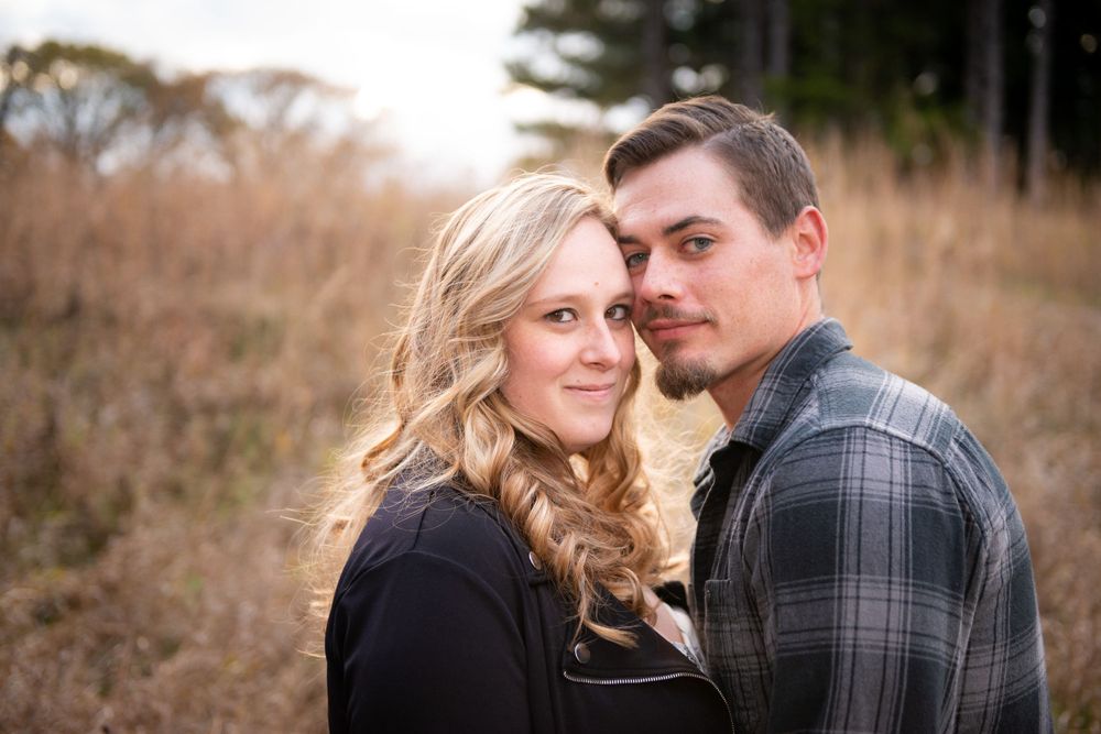 An intimate autumn portrait session with soft natural lighting and fall colors.