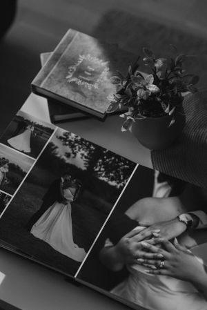 Black and white spread of wedding album pages showing romantic moments and memories.