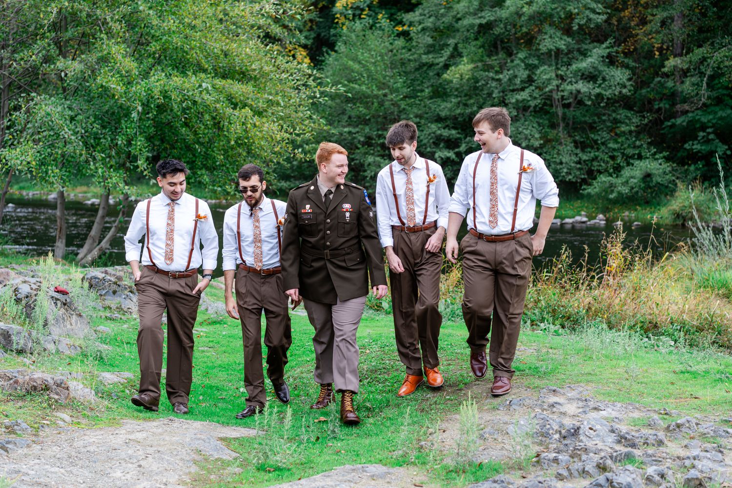 groom laughs with his groomsmen