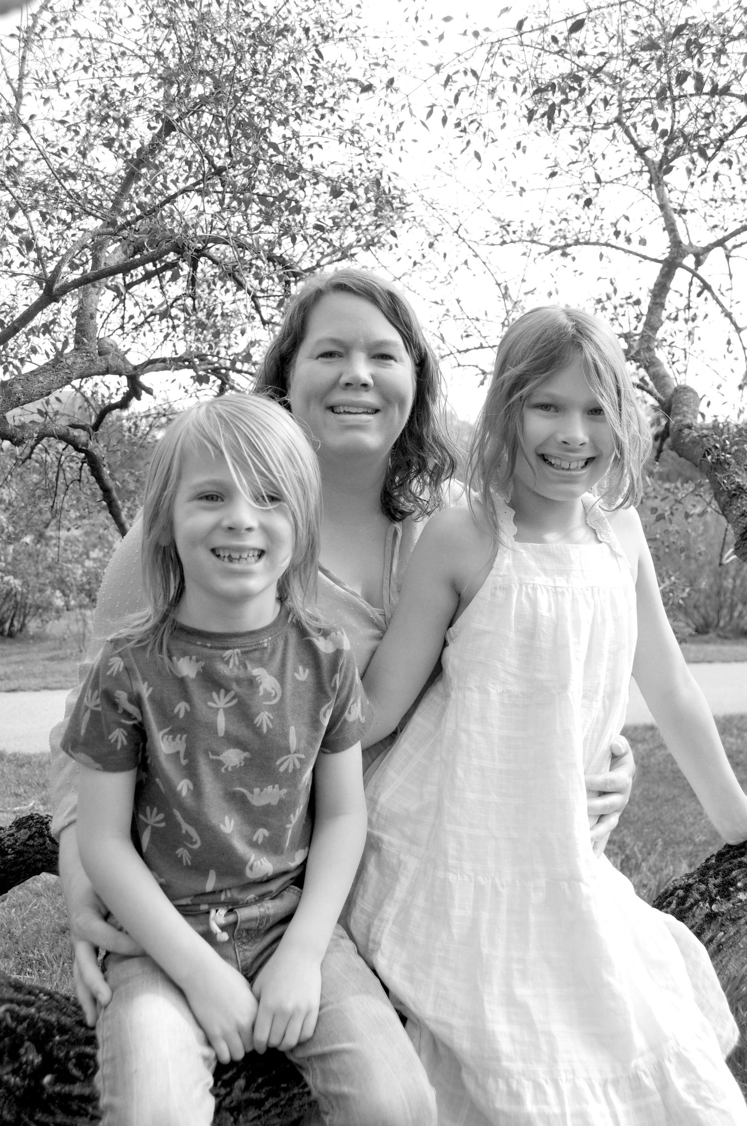 Mom and kids outside in black and white picture