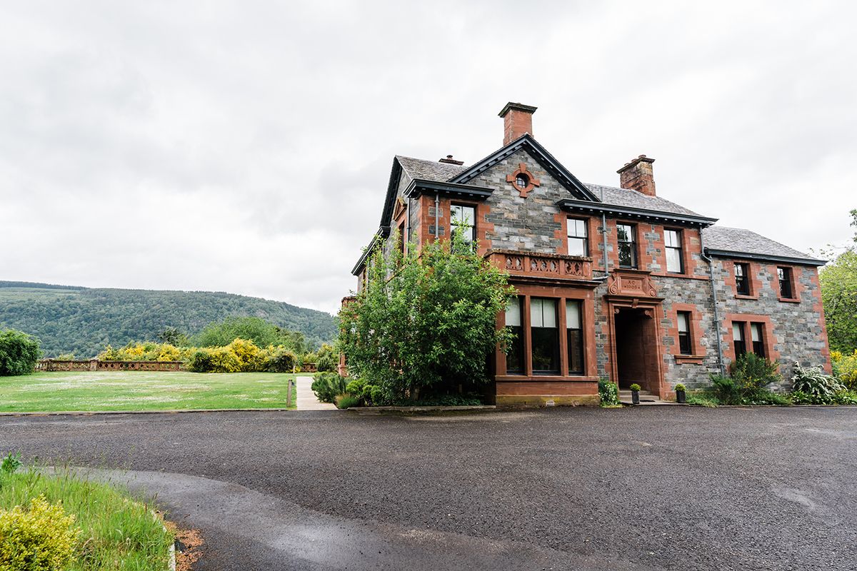 A mansion house is highland perthshire scotland called Dun Aluinn exterior with view