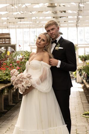 Cora Emilie Media Romantic greenhouse wedding photoshoot with soft natural lighting and floral details.