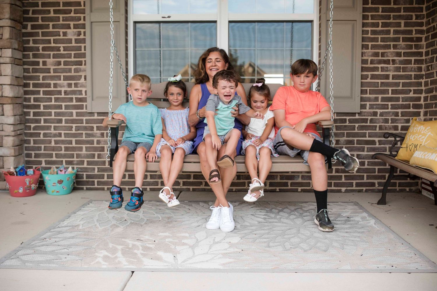 Grandmom and grandkids on front porch