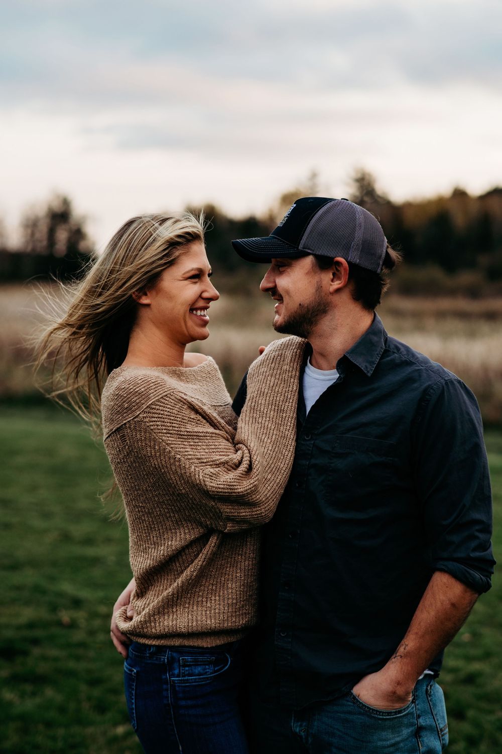 Couple posing for couples photosession in Orr, MN.
