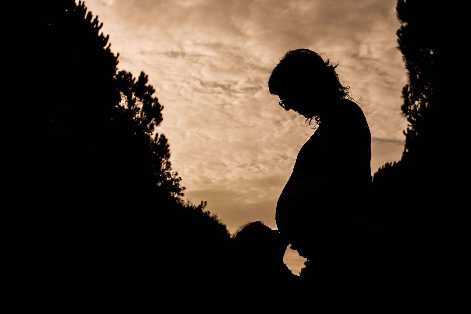 Pregnant woman photography with her little daughter