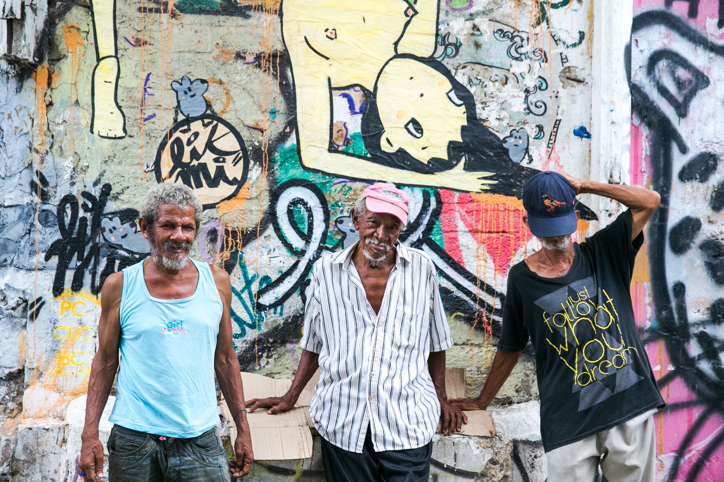Colorful street art and graffiti murals covering urban walls.