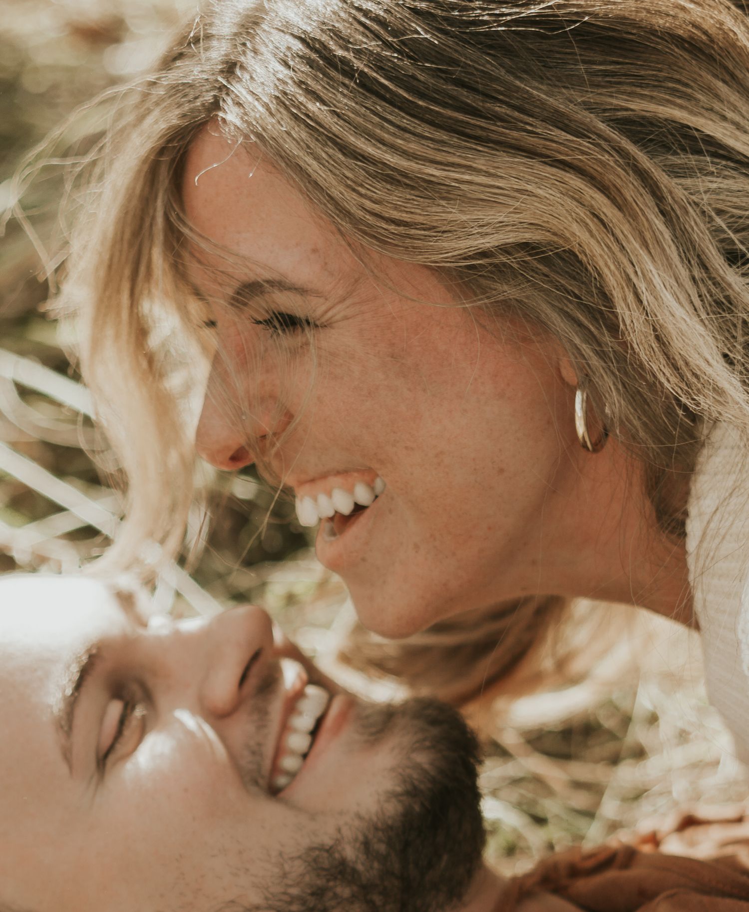 Romantic couple sharing intimate close-up moments in a series of candid photographs taken in Michigan.