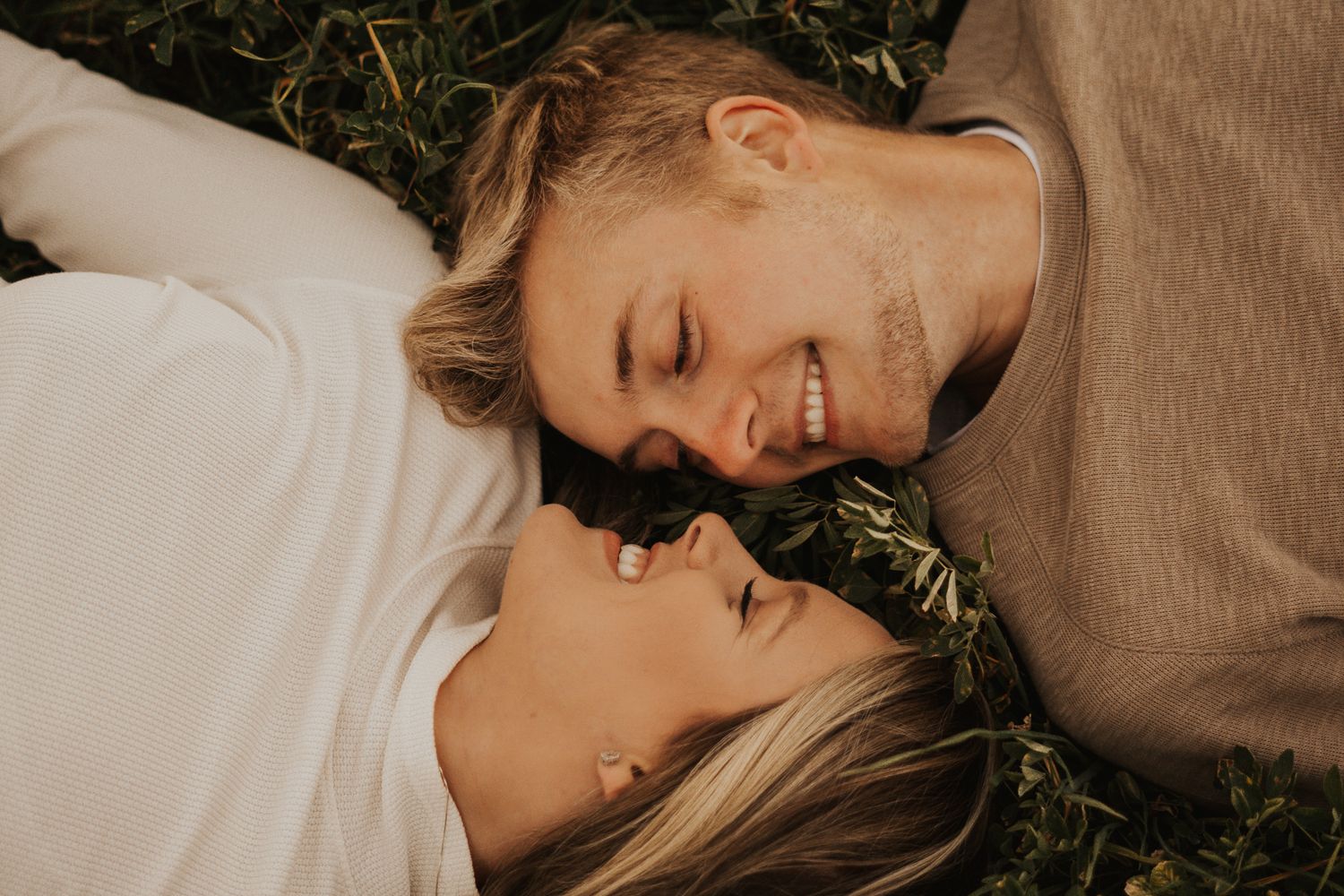 Intimate couple's portrait session in warm autumn lighting.