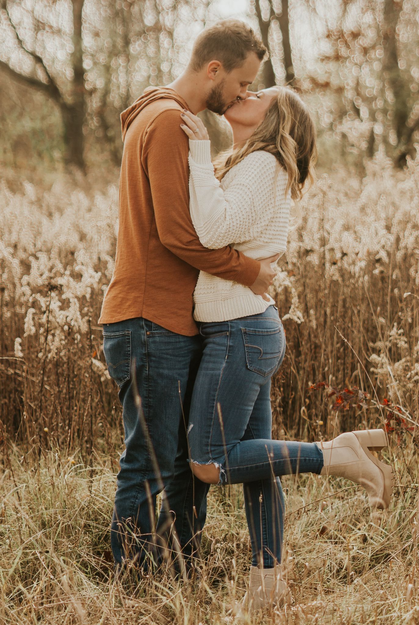Intimate family moments captured in a rustic field setting.