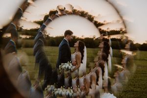 Creative wedding ceremony photo captured through prism lens with artistic distortion effect.