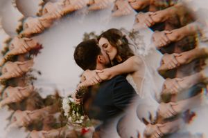 Romantic wedding couple embracing in a uniquely captured double exposure photo with flowers.