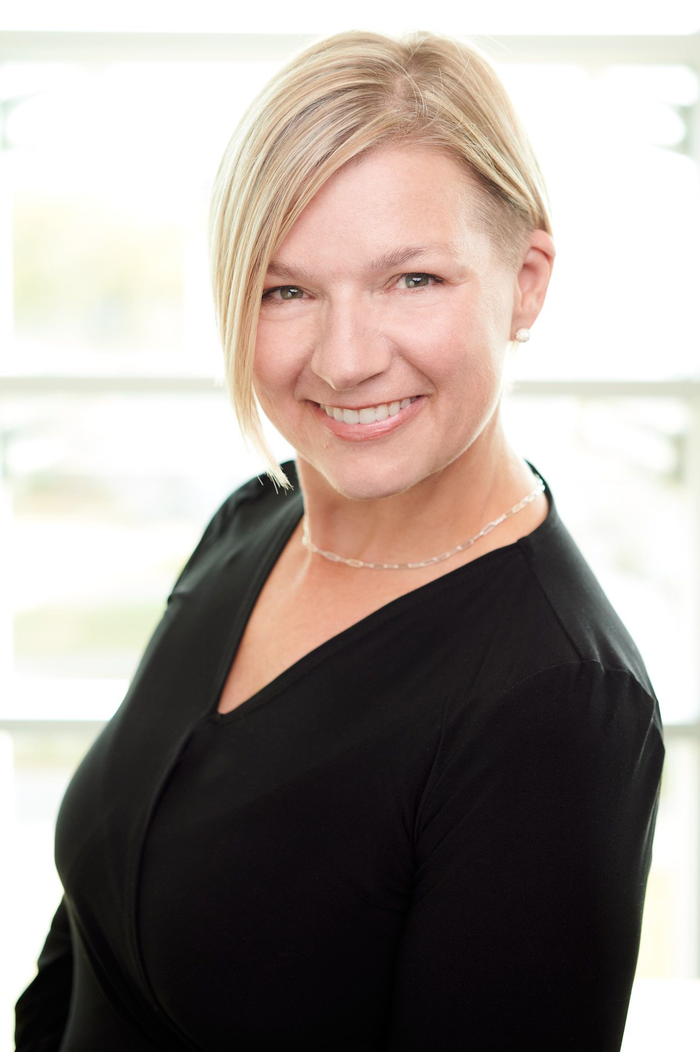Corporate Headshot of White Female Executive