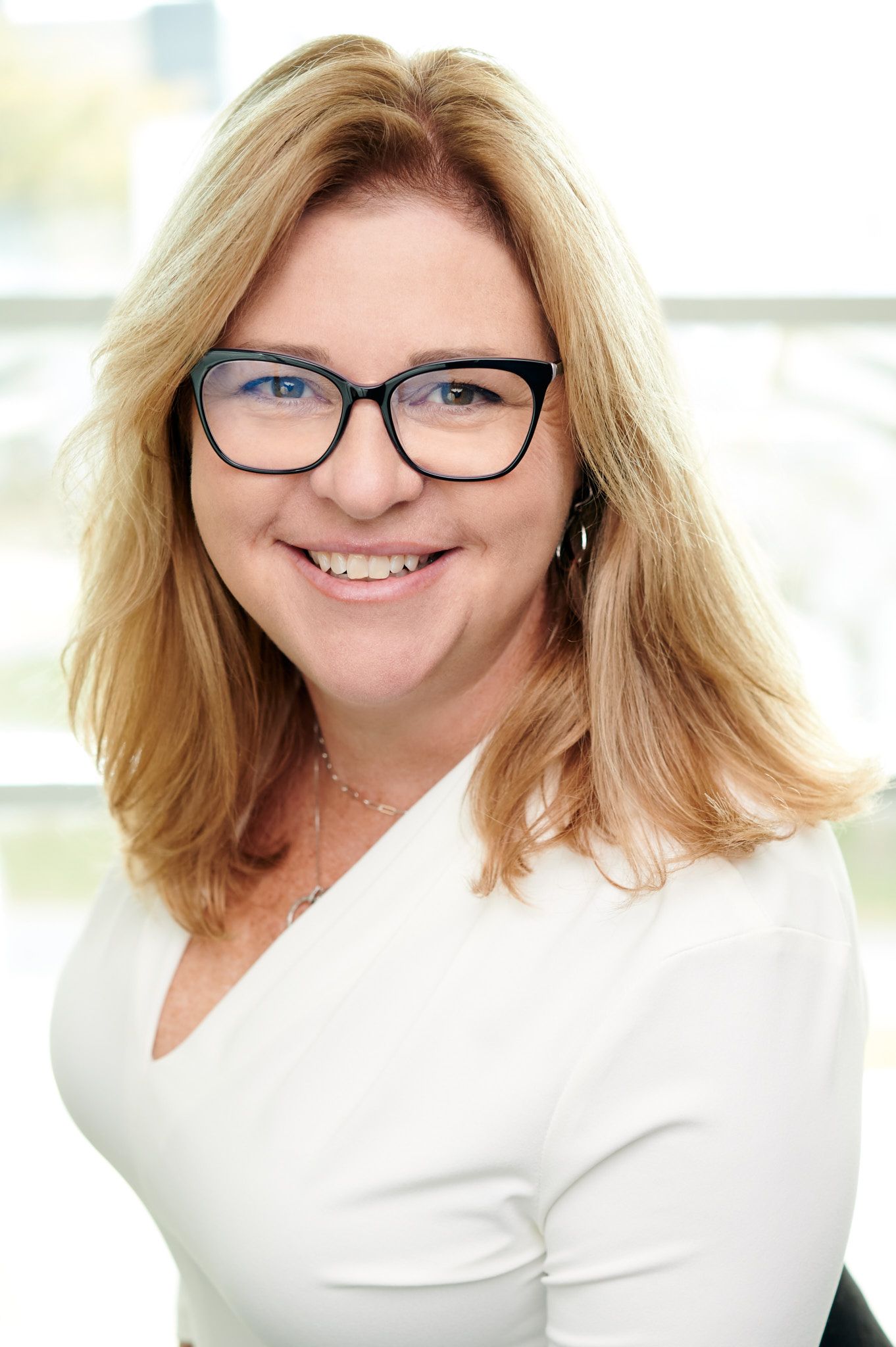 Corporate Headshot of White Female Senior Executive