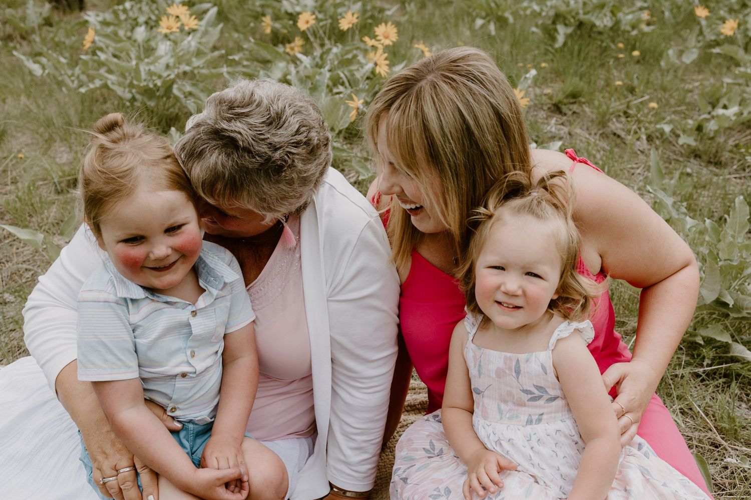 Candid family moment captured outdoors with shared laughter and joy.