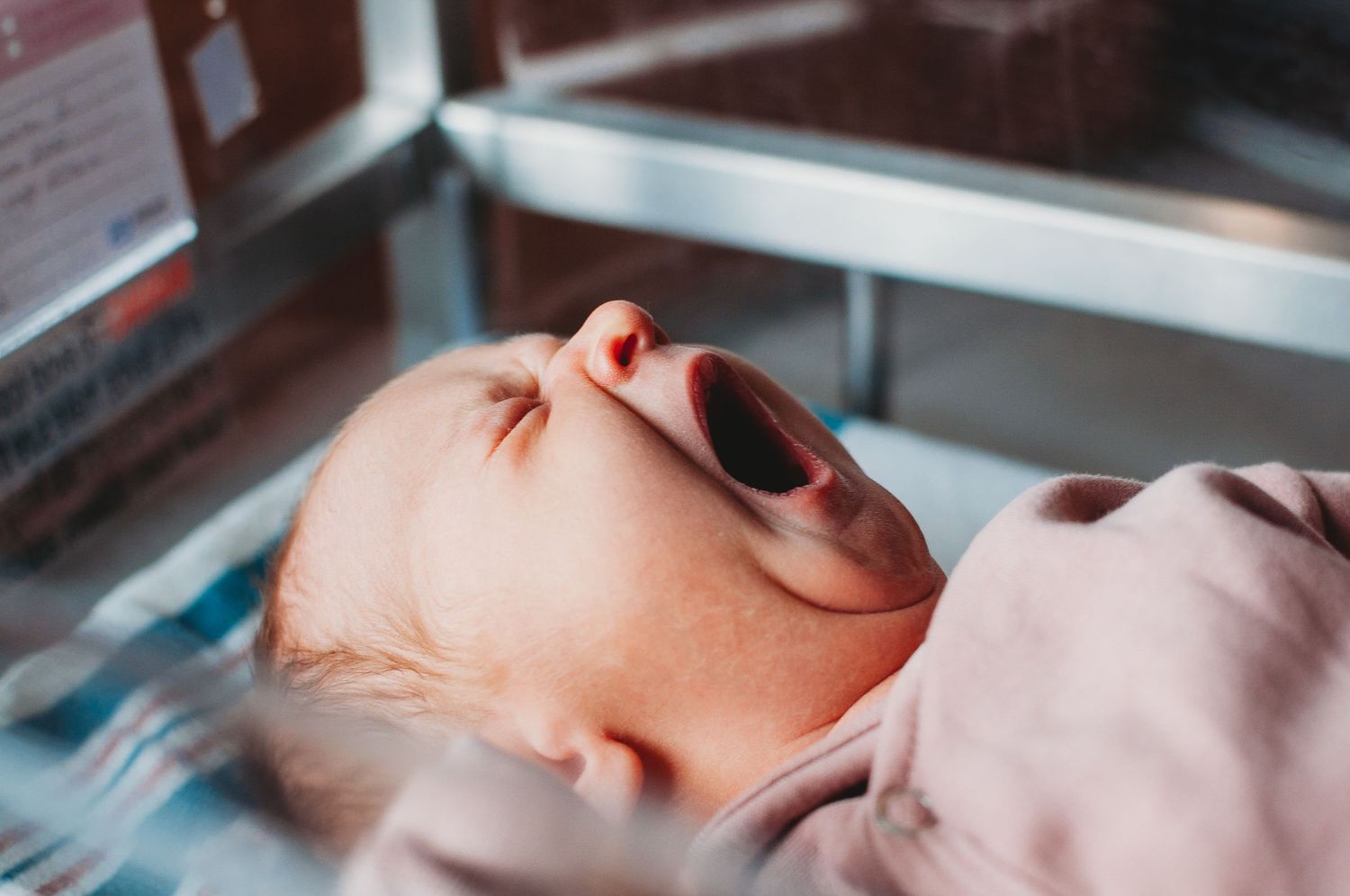 Fresh 48 newborn photography in Dickinson, ND - cozy hospital session capturing newborn first moments