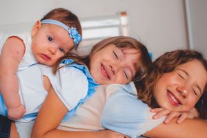 Cheerful family photo showing bright smiles and tender expressions.