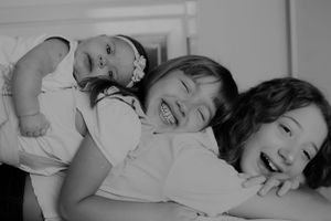 Black and white portrait capturing a loving family moment.