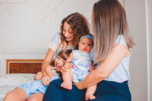 Candid family moment showing interaction and bonding on a bed.