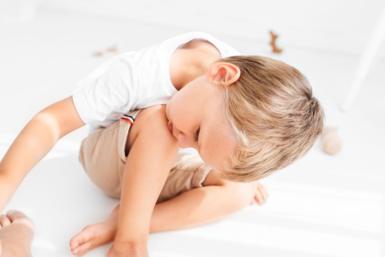 all white natural photoshoot boy playing with blocks Hereford