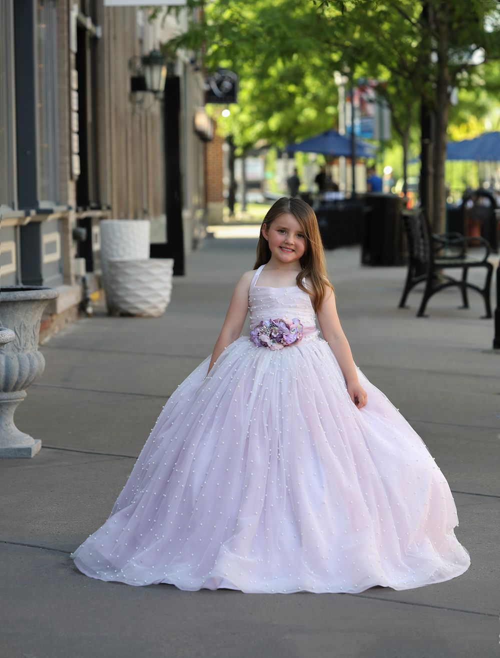Young girl in a pink couture dress in downtown Northville, Michigan