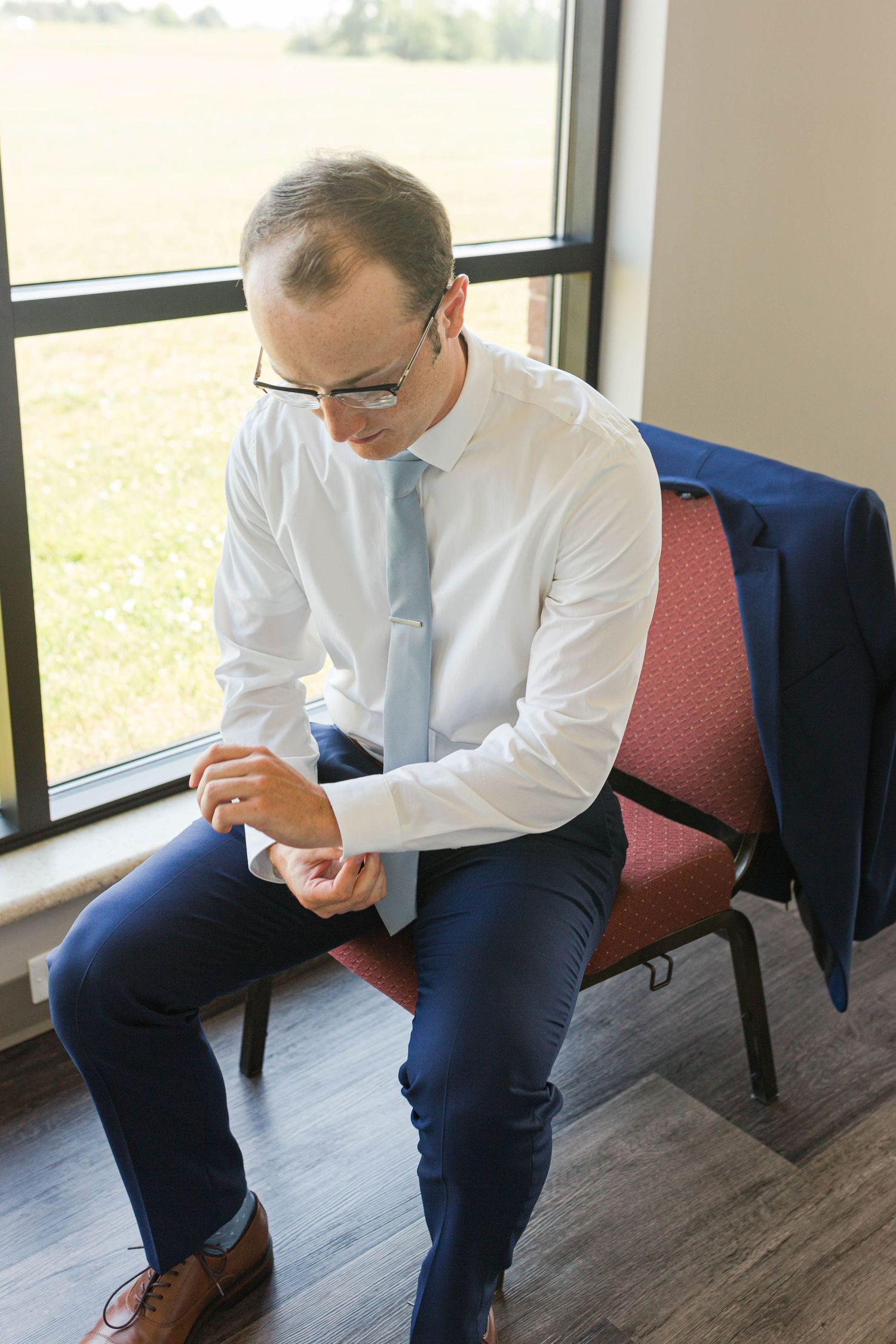 Groom getting ready for ceremony