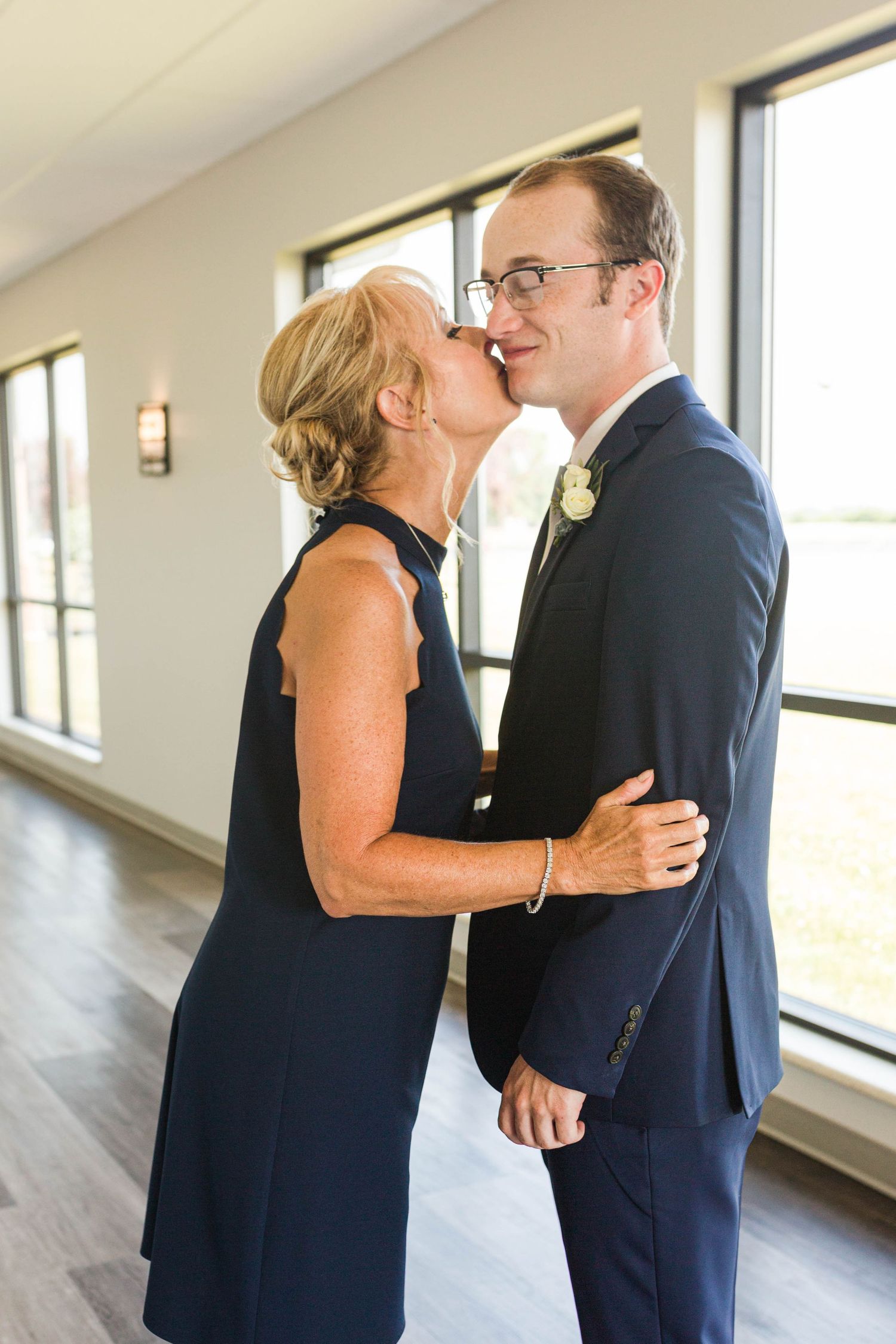 Groom and mom on wedding day